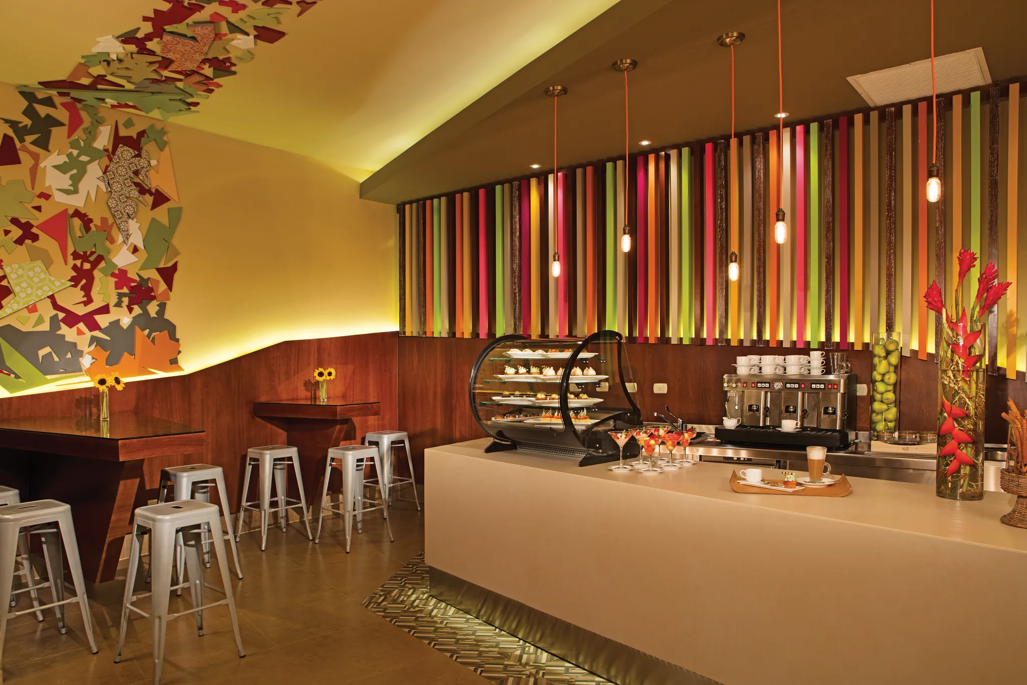 Coco Café at Secrets Royal Beach Punta Cana featuring a colorful modern coffee bar serving pastries, desserts, and premium coffee.