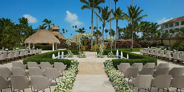 Fountain garden ceremony setup with floral aisle at Secrets Royal Beach Punta Cana