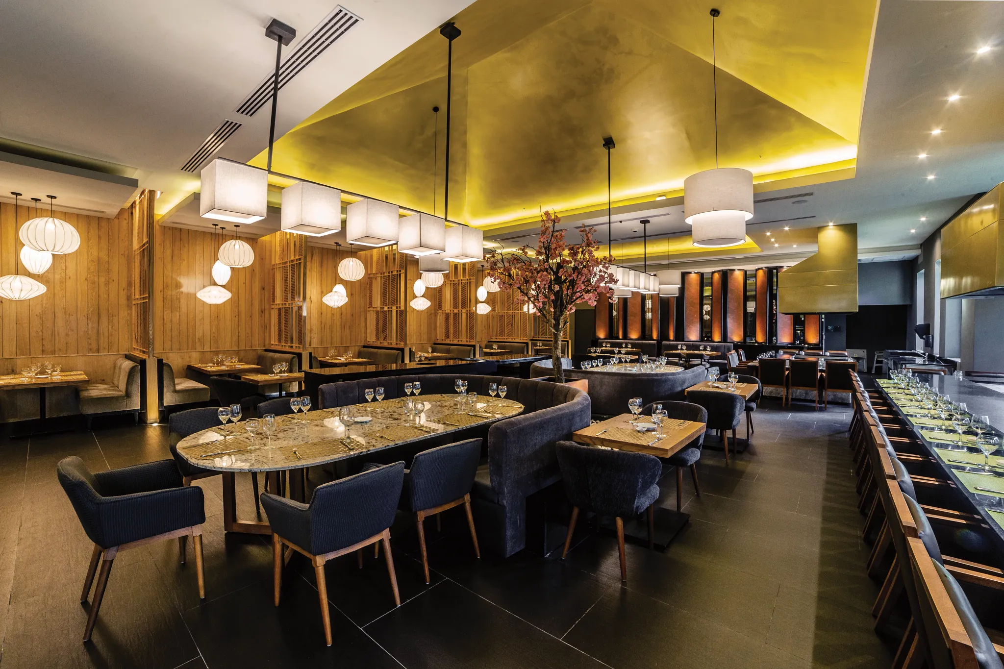 Himitsu Pan-Asian Restaurant at Secrets Royal Beach Punta Cana featuring elegant Asian-inspired décor, sushi bar seating, and modern dining tables.