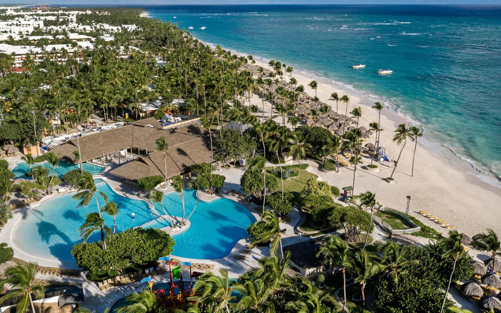 Iberostar Selection Bavaro Suites luxury all-inclusive resort in Punta Cana with expansive pools, tropical gardens, and family-friendly amenities.