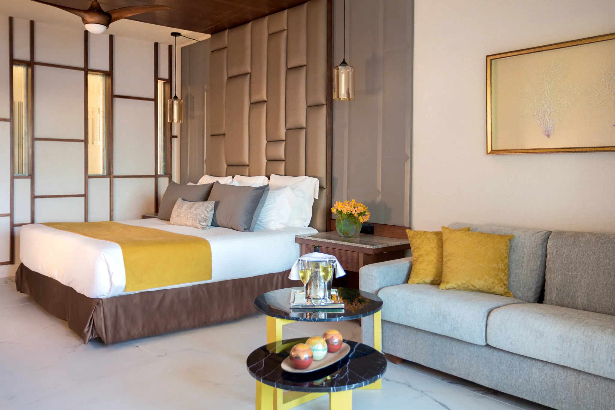 Preferred Club Junior Suite Partial Ocean View with king bed and seating area at Secrets Royal Beach Punta Cana.