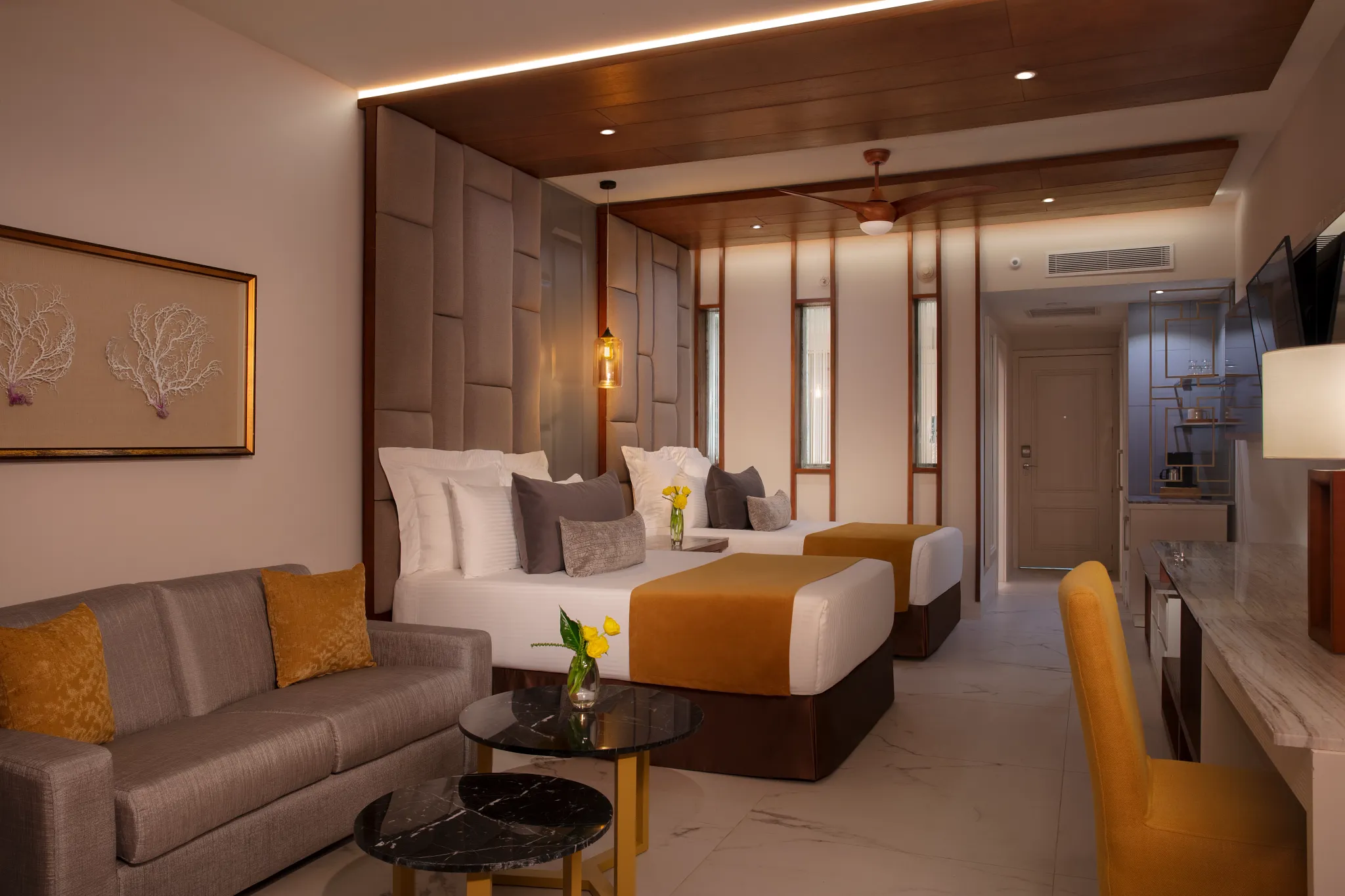 Preferred Club Junior Suite Private Pool with two double beds and seating area at Secrets Royal Beach Punta Cana.