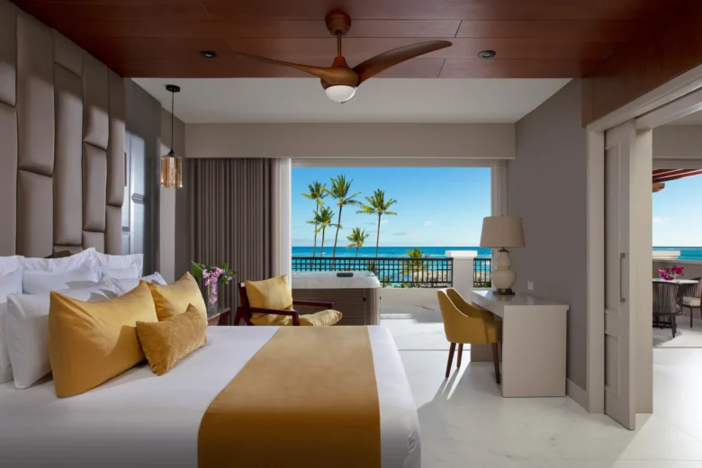 Preferred Club Master Suite Ocean Front bedroom with king bed and ocean view terrace at Secrets Royal Beach Punta Cana.