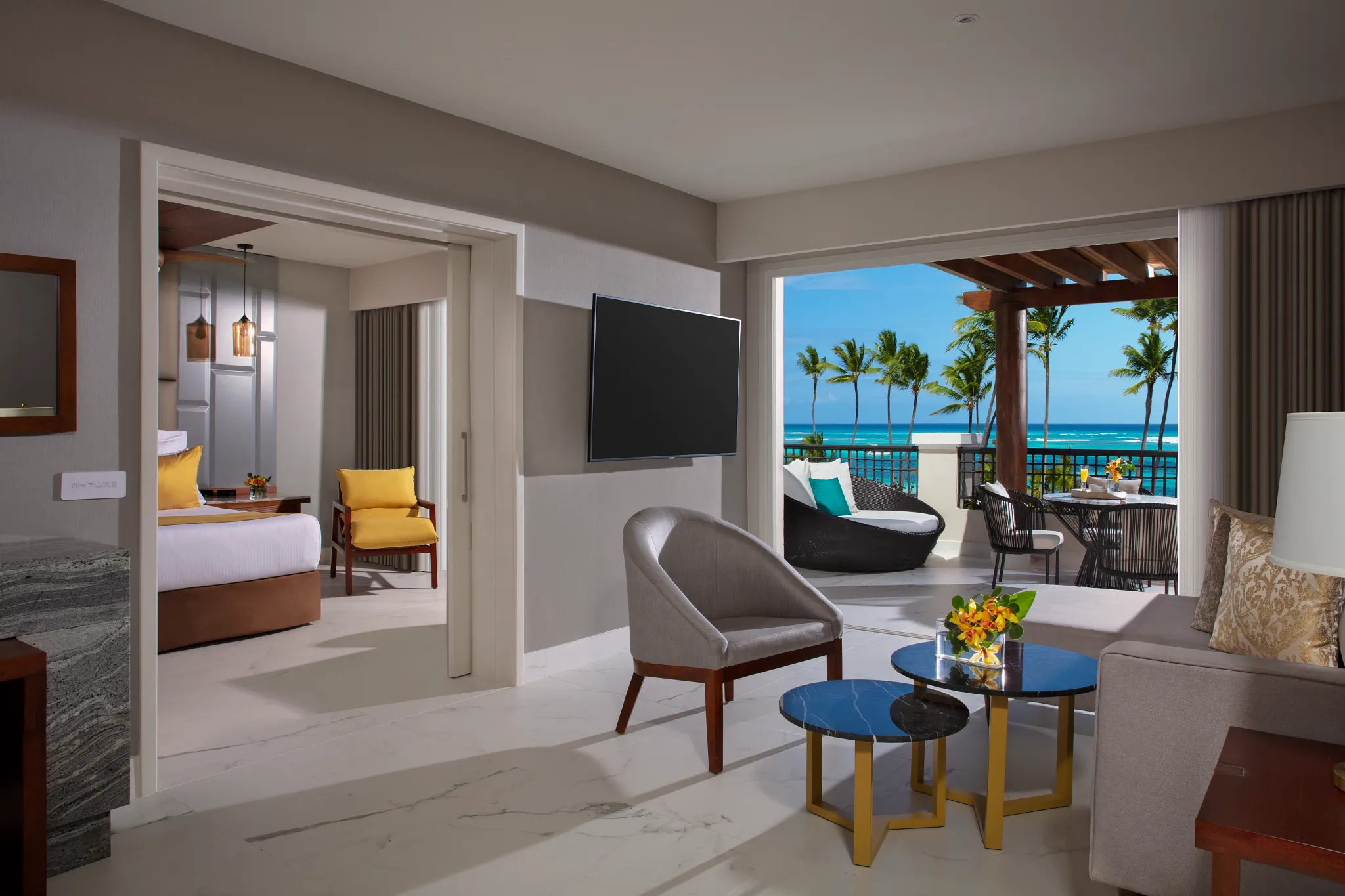 Preferred Club Master Suite Ocean Front living room with balcony view at Secrets Royal Beach Punta Cana.
