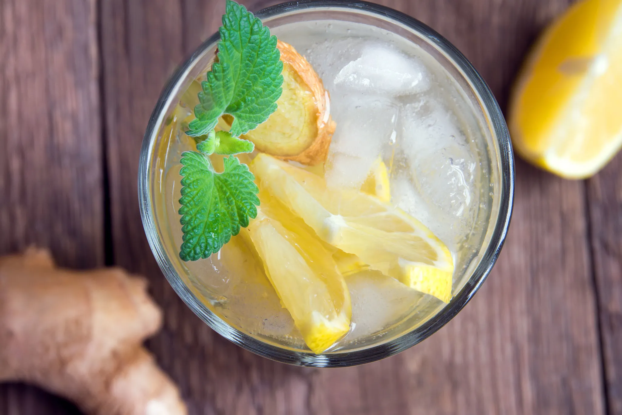 Preferred Club Pool Bar cocktail at Secrets Royal Beach Punta Cana featuring a refreshing citrus drink with lemon and mint garnish.