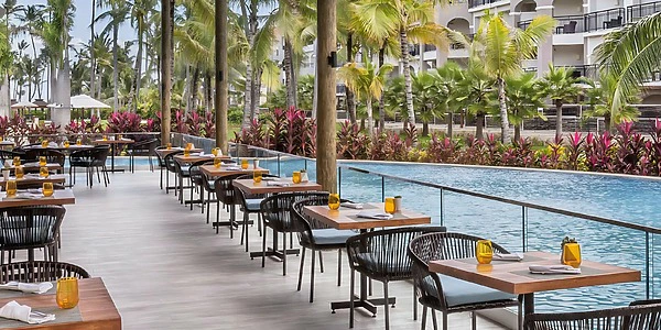 Riviera Terrace poolside dining and event setup at Secrets Royal Beach Punta Cana