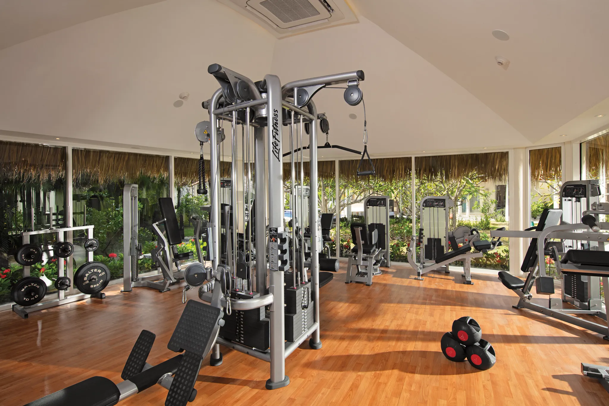 Modern fitness center with strength training equipment at Secrets Royal Beach Punta Cana resort.