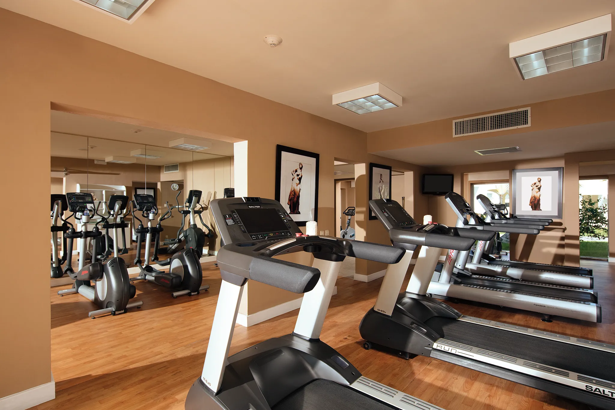Cardio machines and treadmills inside the gym at Secrets Royal Beach Punta Cana.